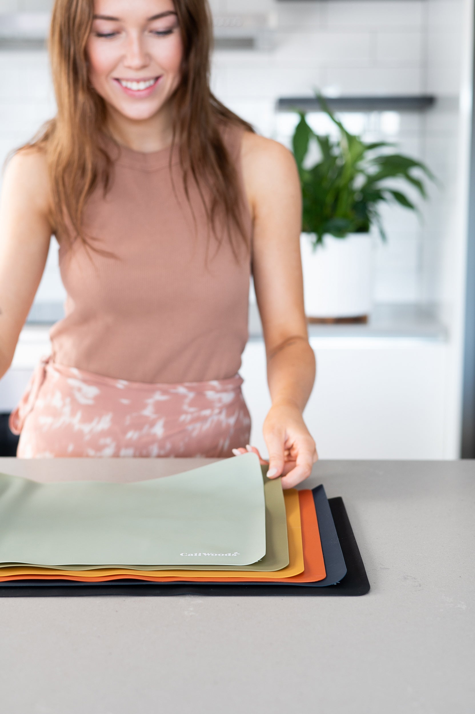Baking Mats with woman holding them with her hands