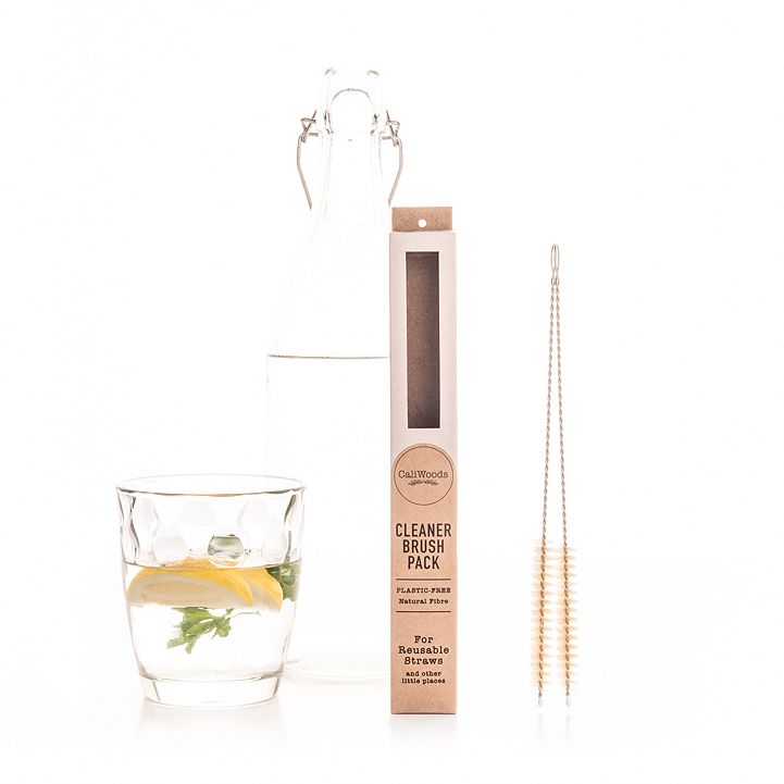 CaliWoods Cleaner Brush pack, a small brush for cleaning coffee machines and drink bottles, with a glass next to it.