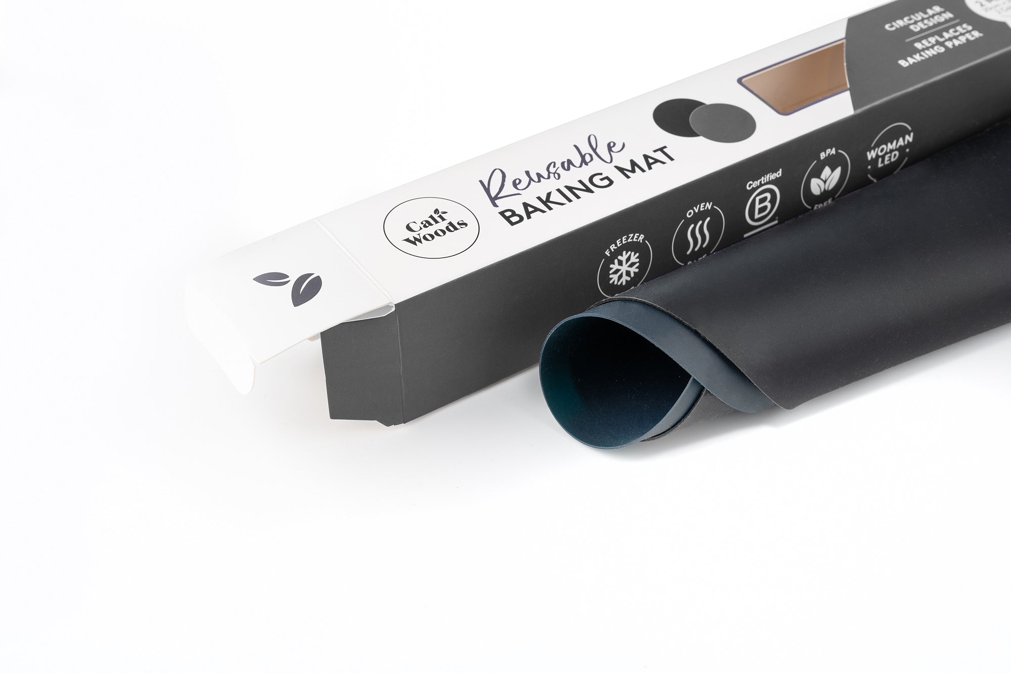 Circular Reusable Baking Mat pack rolled up next to the box