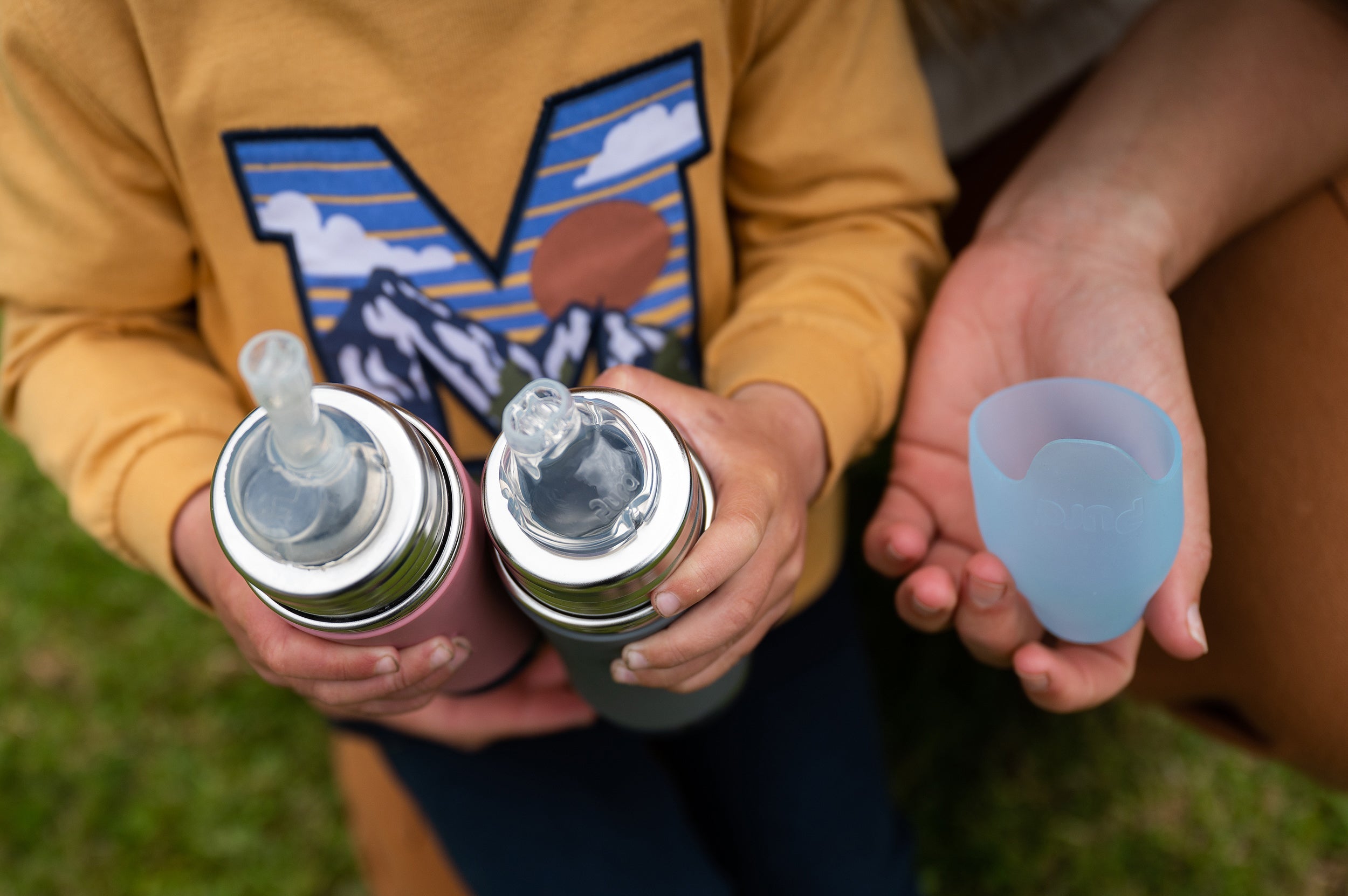 Pura toddler water bottle in hands