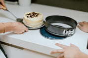 Cake on a circular baking mat on a kitchen bench