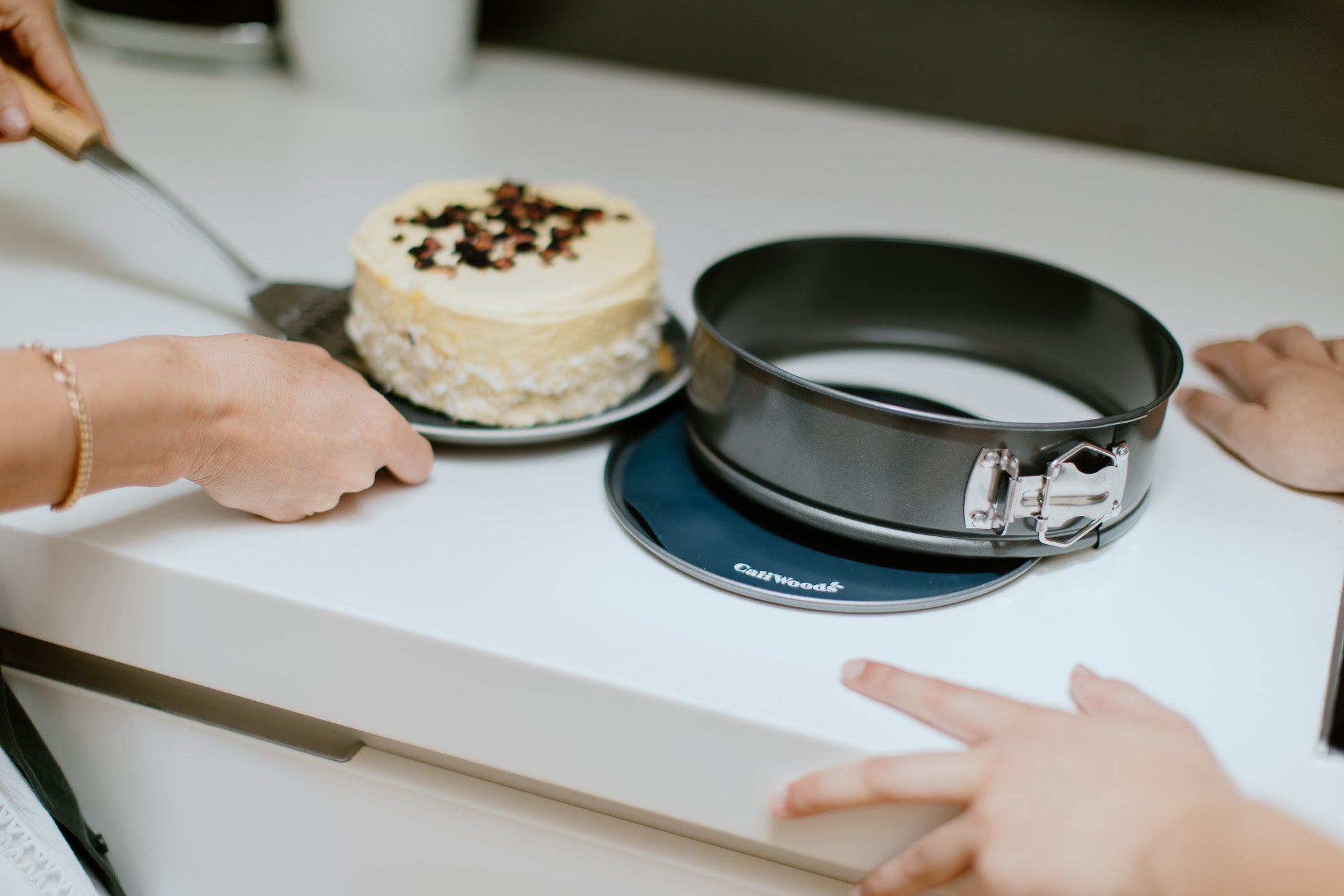 Cake on a circular baking mat on a kitchen bench