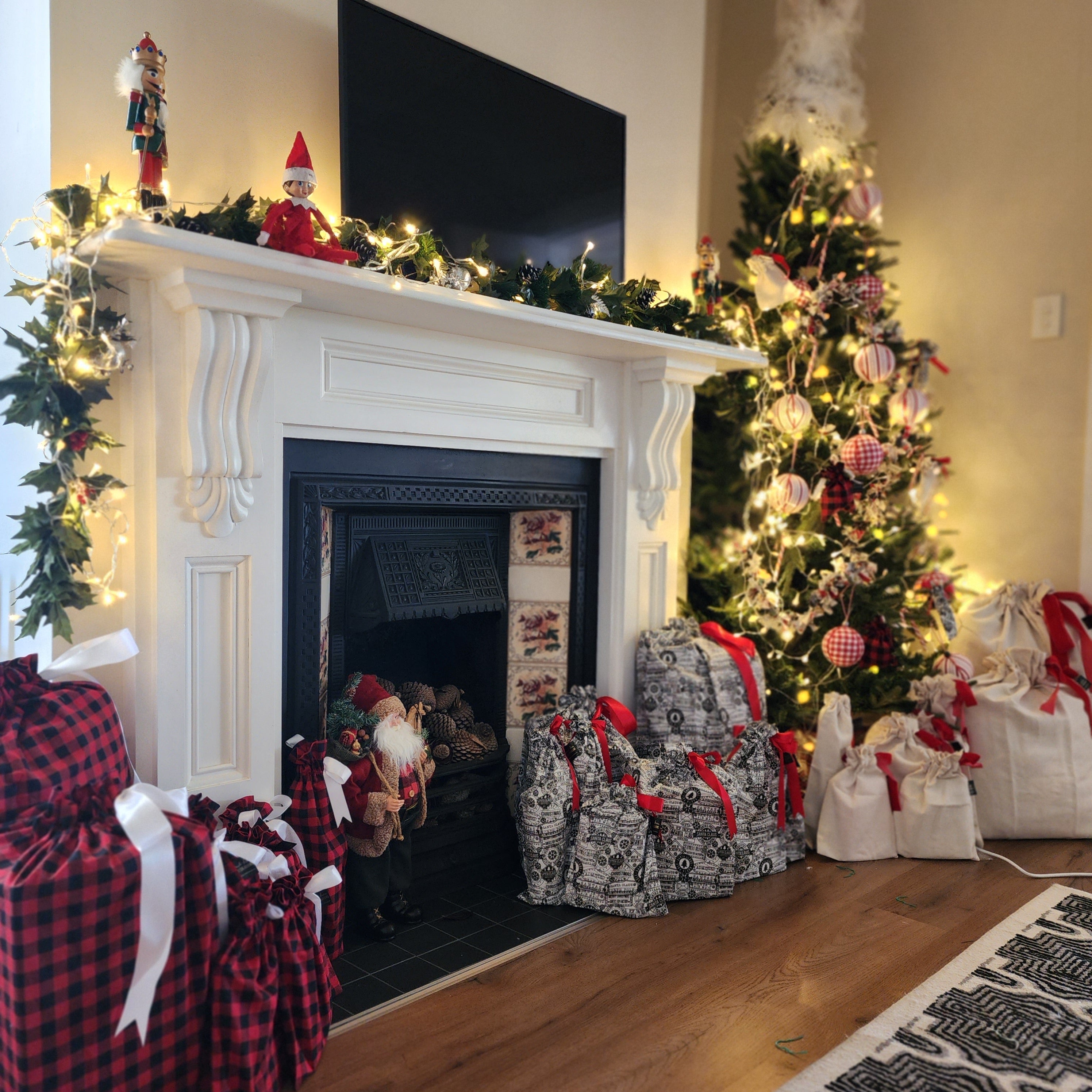 Christmas Scene with tree, lights, and refillable fabric gift bags