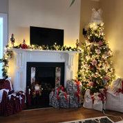 Christmas scene by the fireplace with reusable Gift Bags