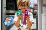 Boy holding reusable ice block moulds