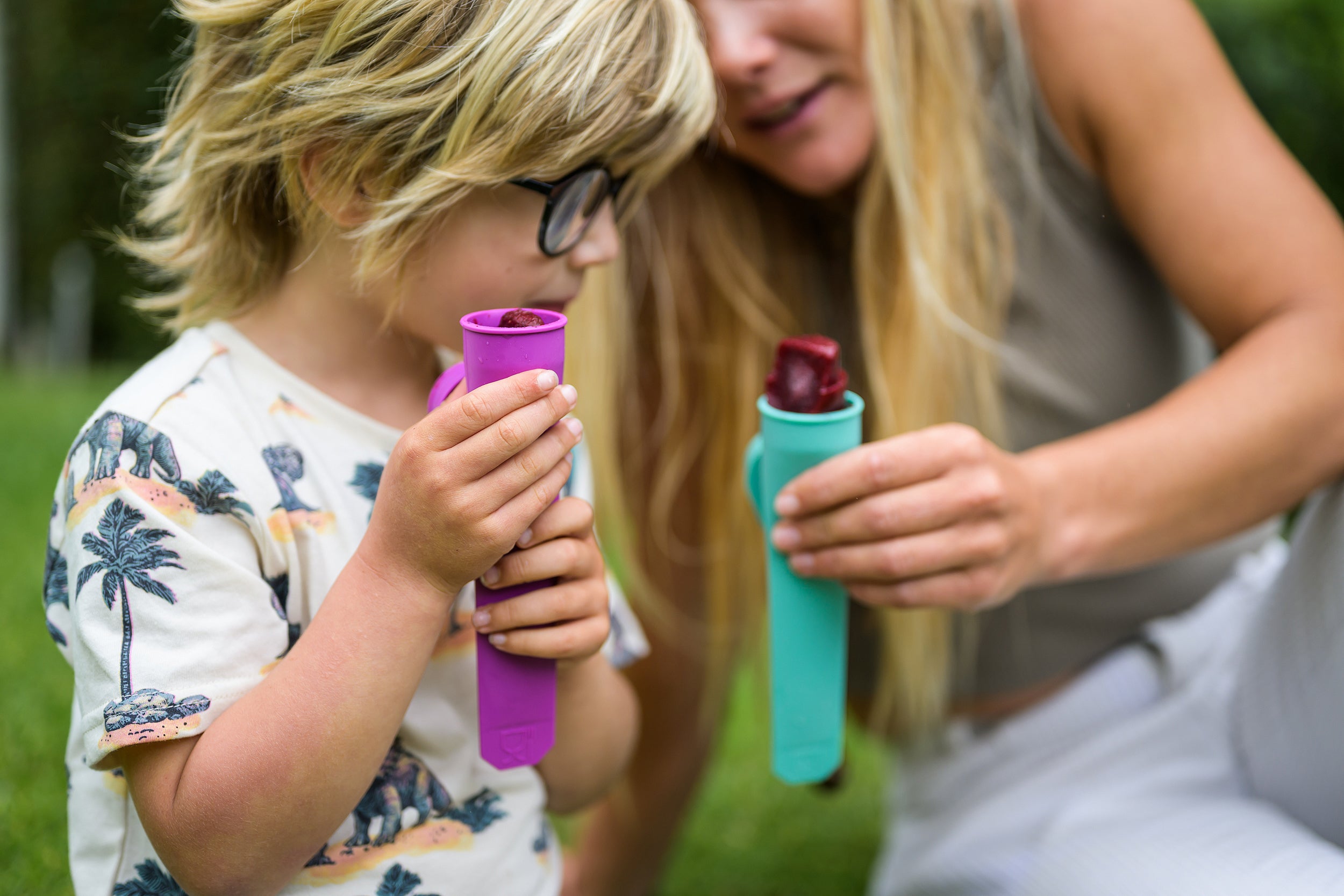 Mother and Son holding Summer homemade Ice Blocks in NZ