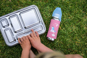 CaliWoods Stainless Lunchbox with Pura toddler drink bottle on the grass