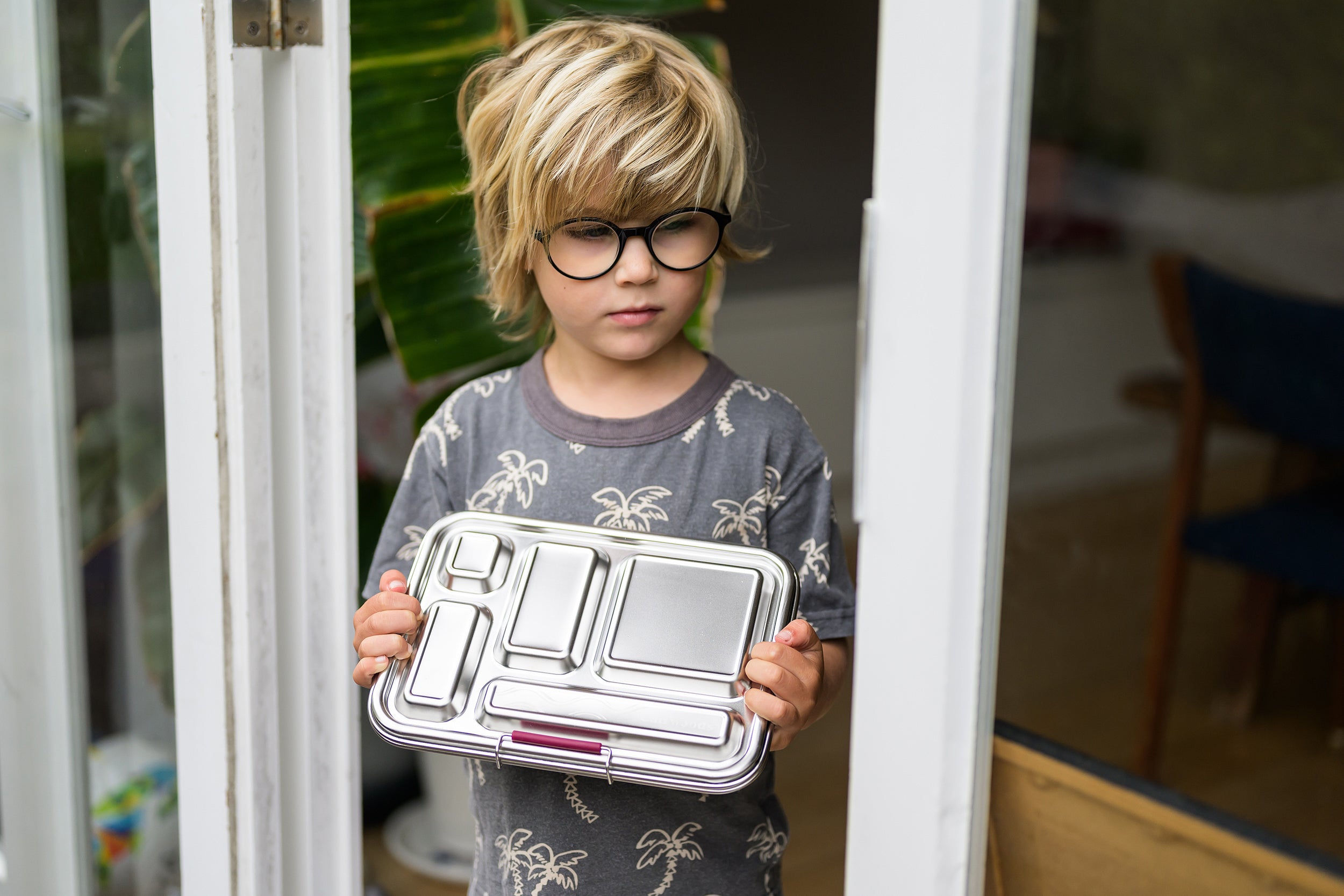 Blonde Boy holding CaliWoods compartment bento lunchbox