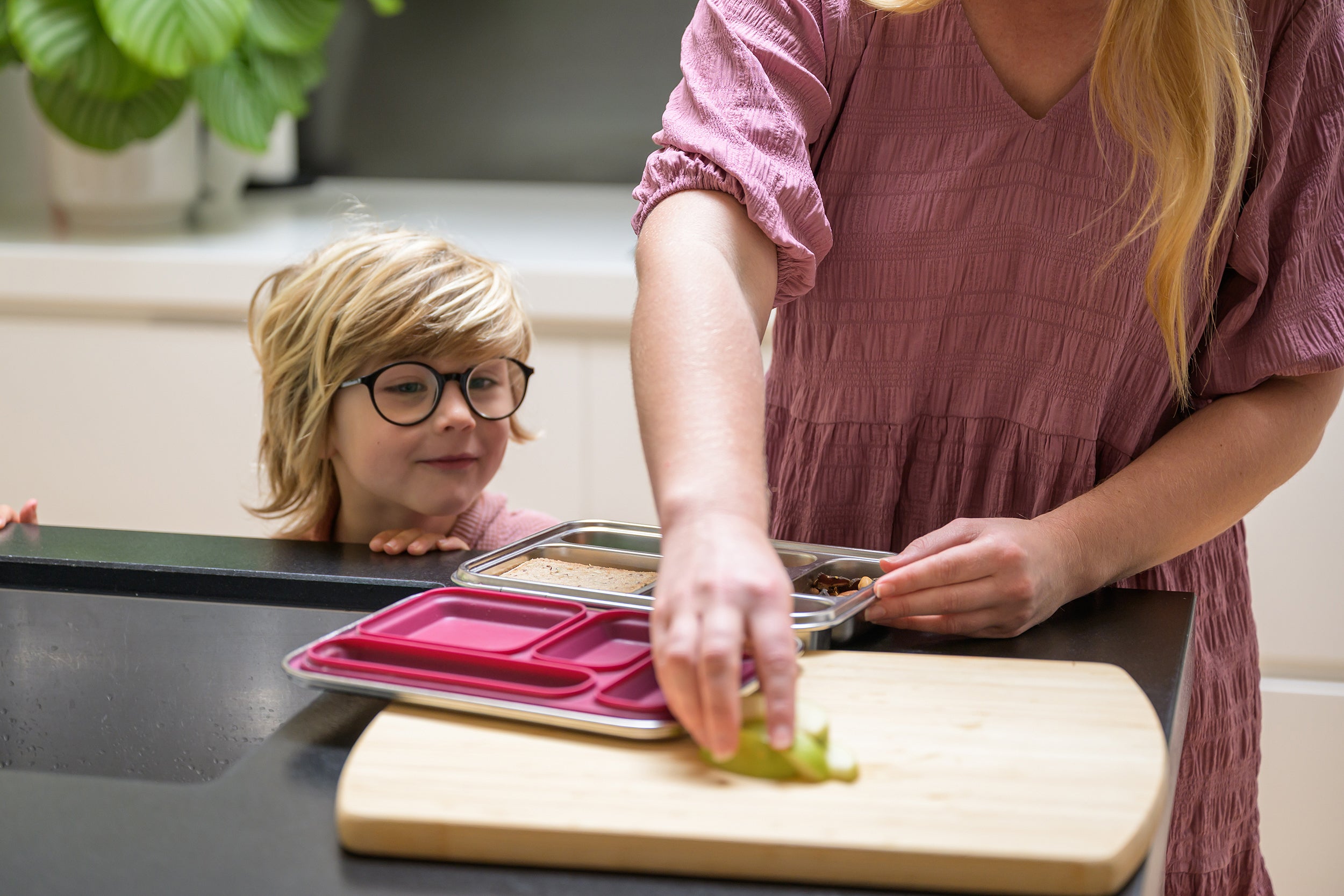 Child looking at Mum packing lunch in a Stainless Bento Lunchbox 