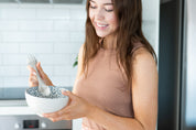 Woman smiling with a Spork 