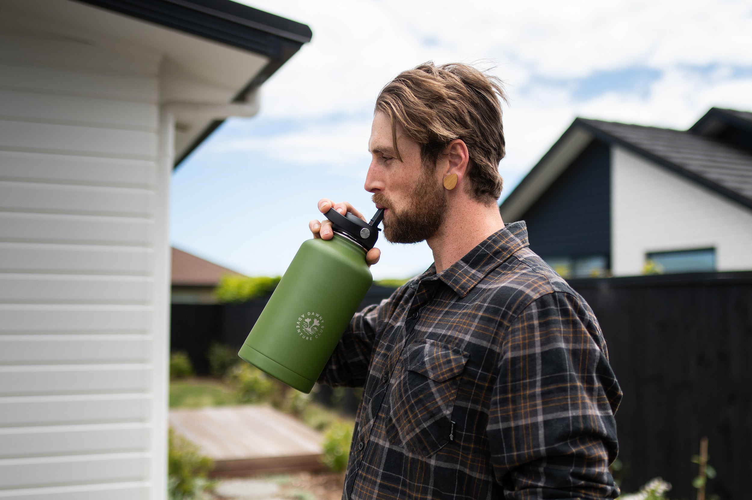 Man sipping from CaliWoods water bottle