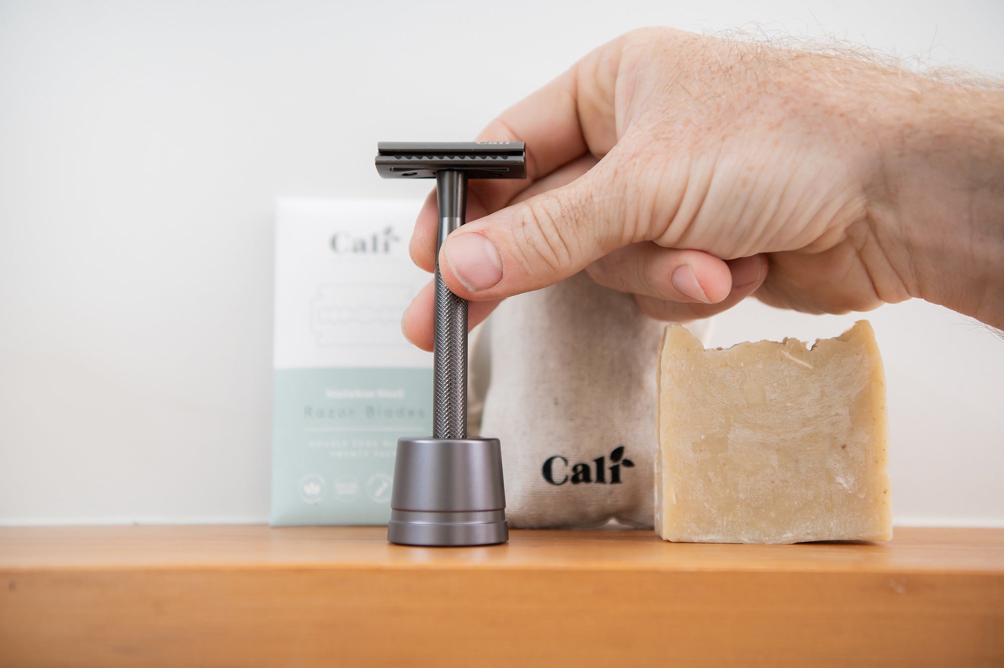 CaliWoods Safety Razor Shaving Kit for men in Slate Grey colour with hand holding the Safety Razor handle