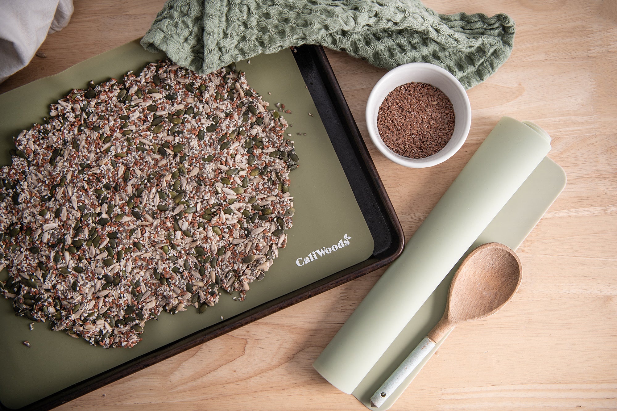 Seedy crackers birds eye view image with Reusable Baking Mat on an oven tray 