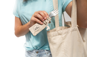 Stainless Spork being put into a CaliWoods tote bag